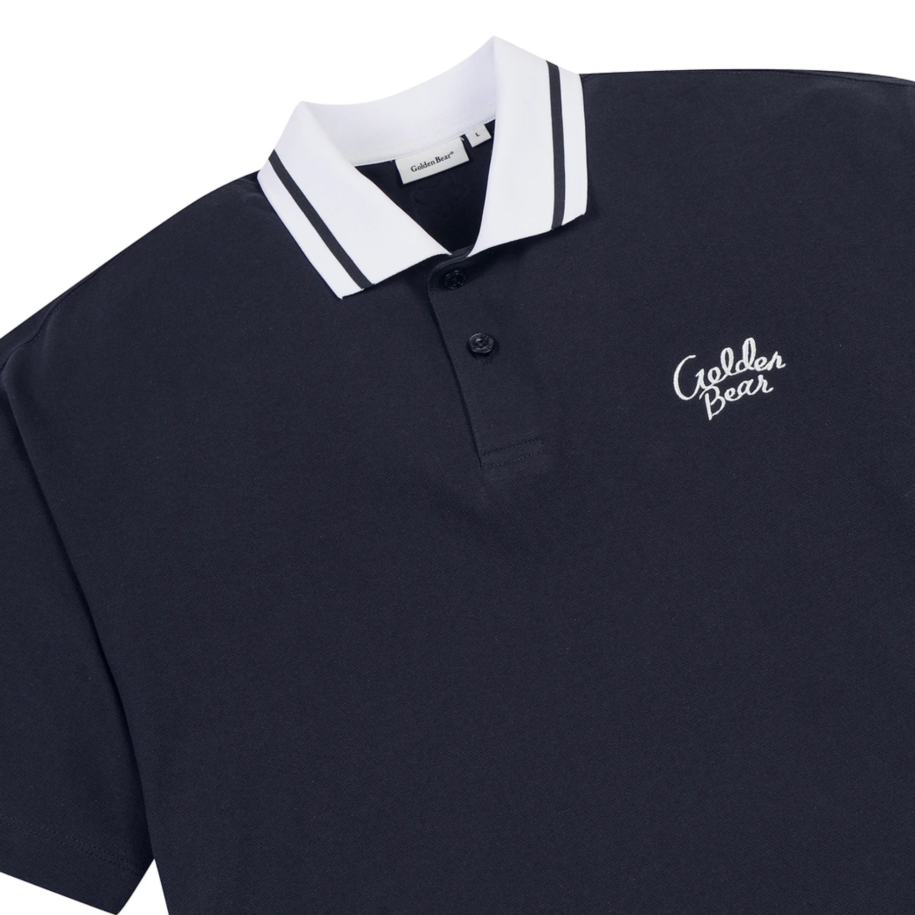 A close-up of a dark navy polo shirt with a white collar featuring thin black stripes, a two-button placket, and a white embroidered 'Golden Bear' logo on the chest.