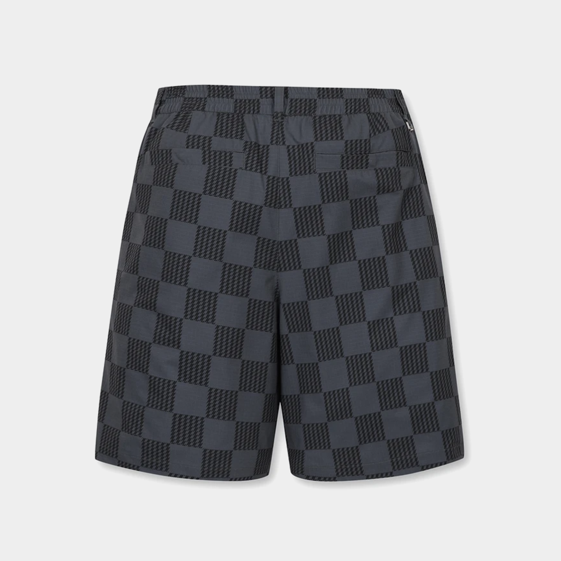 Dark gray and black checkerboard patterned shorts with a textured geometric design, shown against a light gray background.