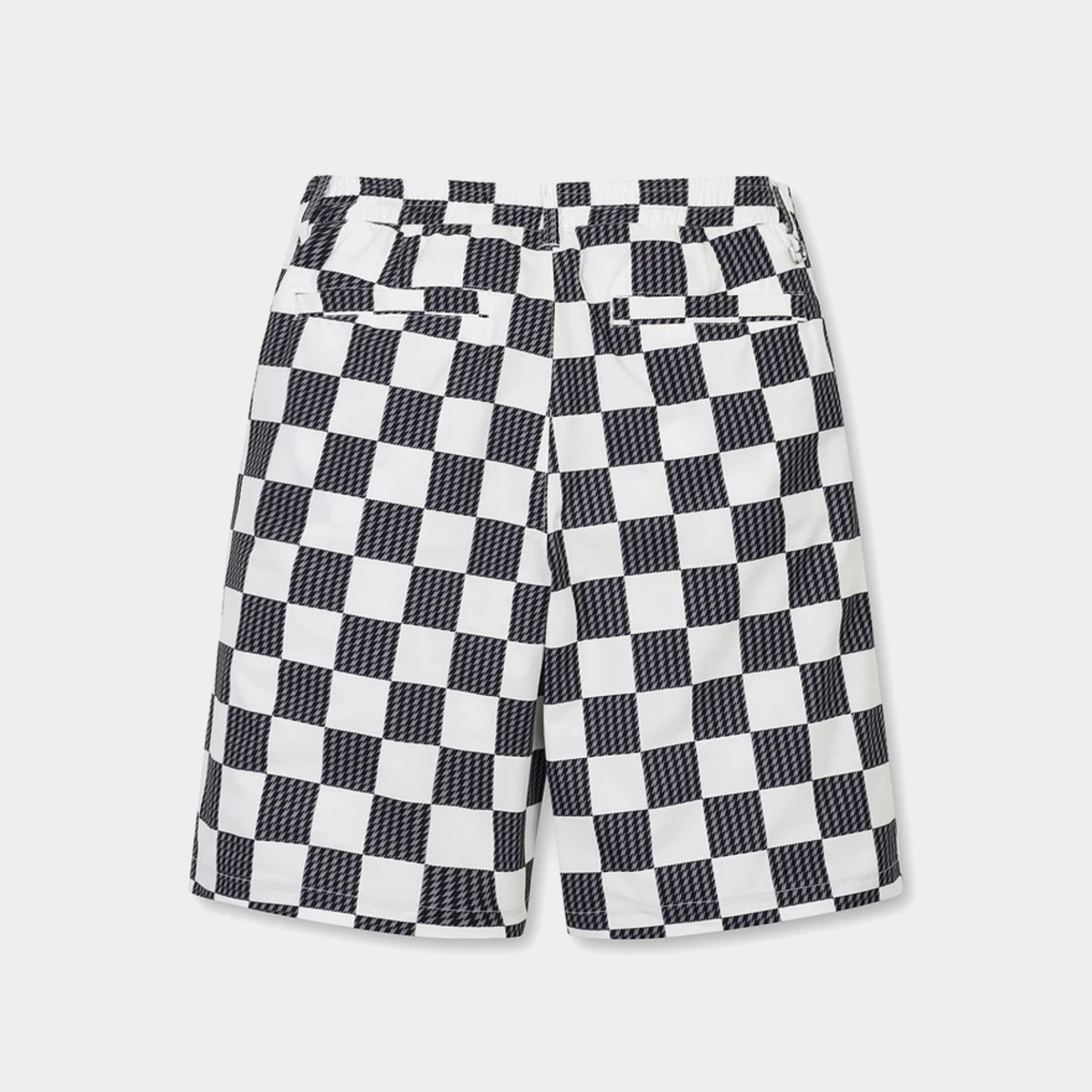 Black and white checkered shorts with a textured pattern, featuring a waistband and side pockets, shown against a light gray background.