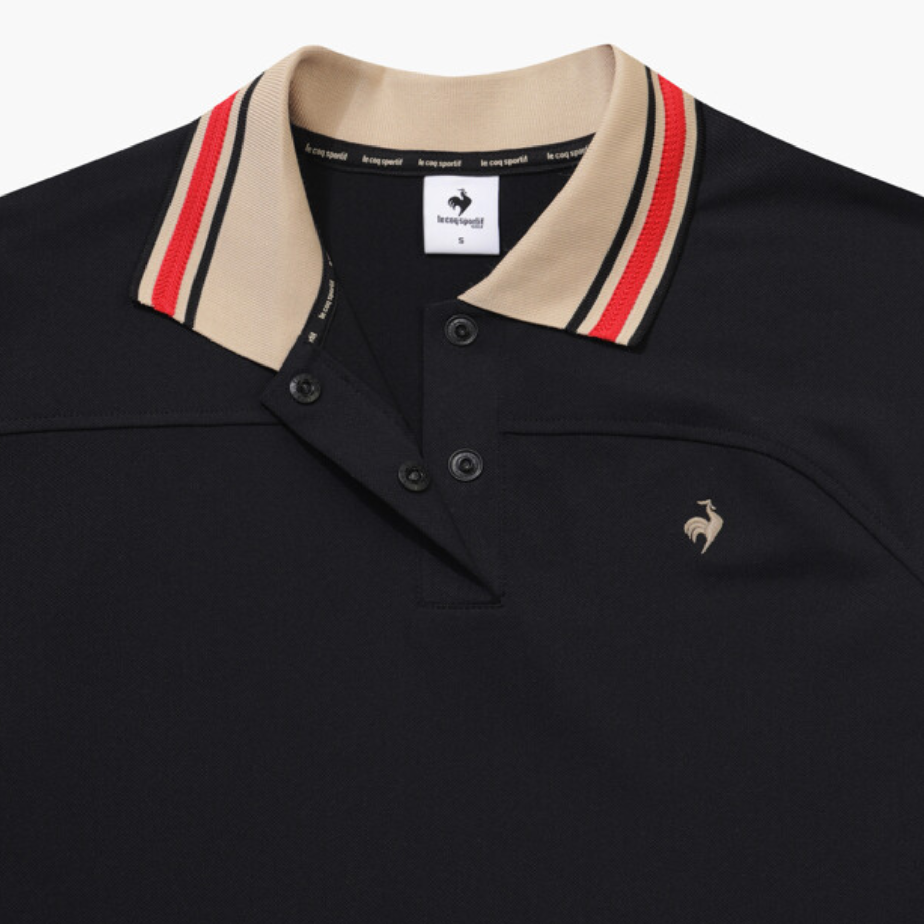 Close-up of a dark navy polo shirt with a beige collar featuring red and navy stripes, and a small embroidered rooster logo on the chest.