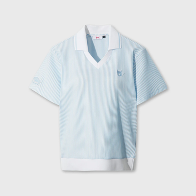 Women's light blue seersucker golf polo with white collar and V-neck ribbed trim.
