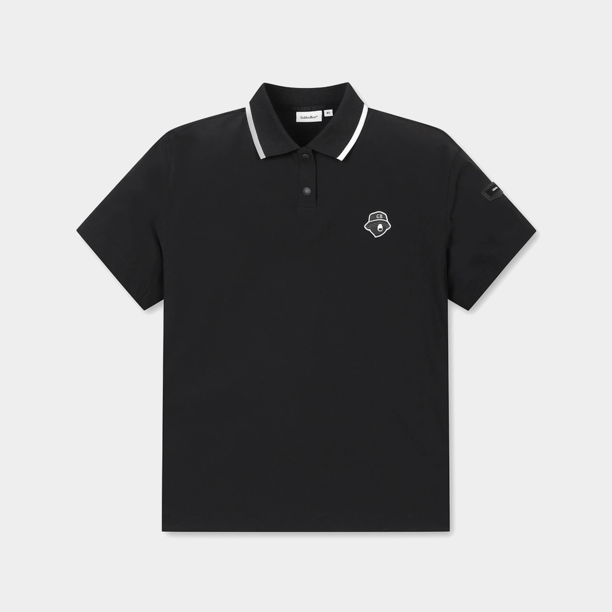 A black short-sleeve polo shirt with a white contrast-trim collar and a small white embroidered shield logo on the left chest, displayed on a light gray background.