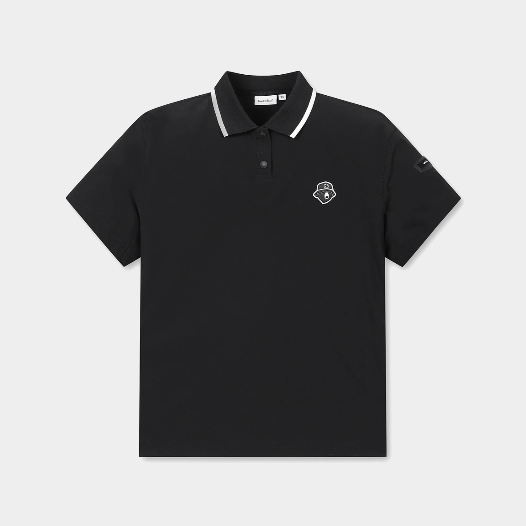 A black short-sleeve polo shirt with a white contrast-trim collar and a small white embroidered shield logo on the left chest, displayed on a light gray background.