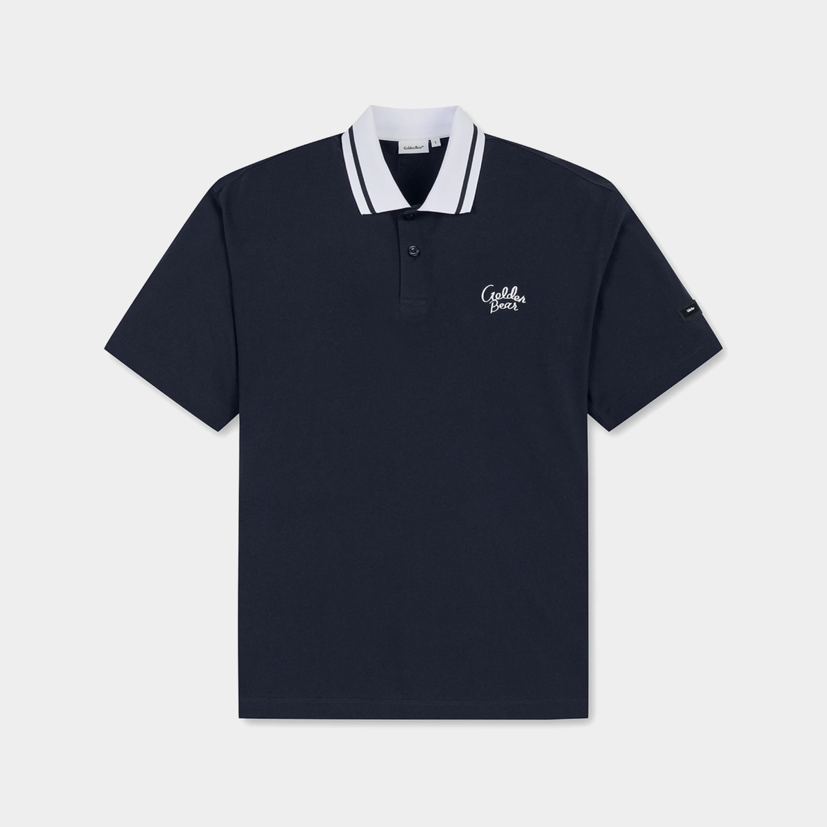 A navy blue short-sleeve polo shirt with a white and navy striped collar, featuring a white embroidered logo on the left chest and a small sleeve logo, displayed on a light gray background.