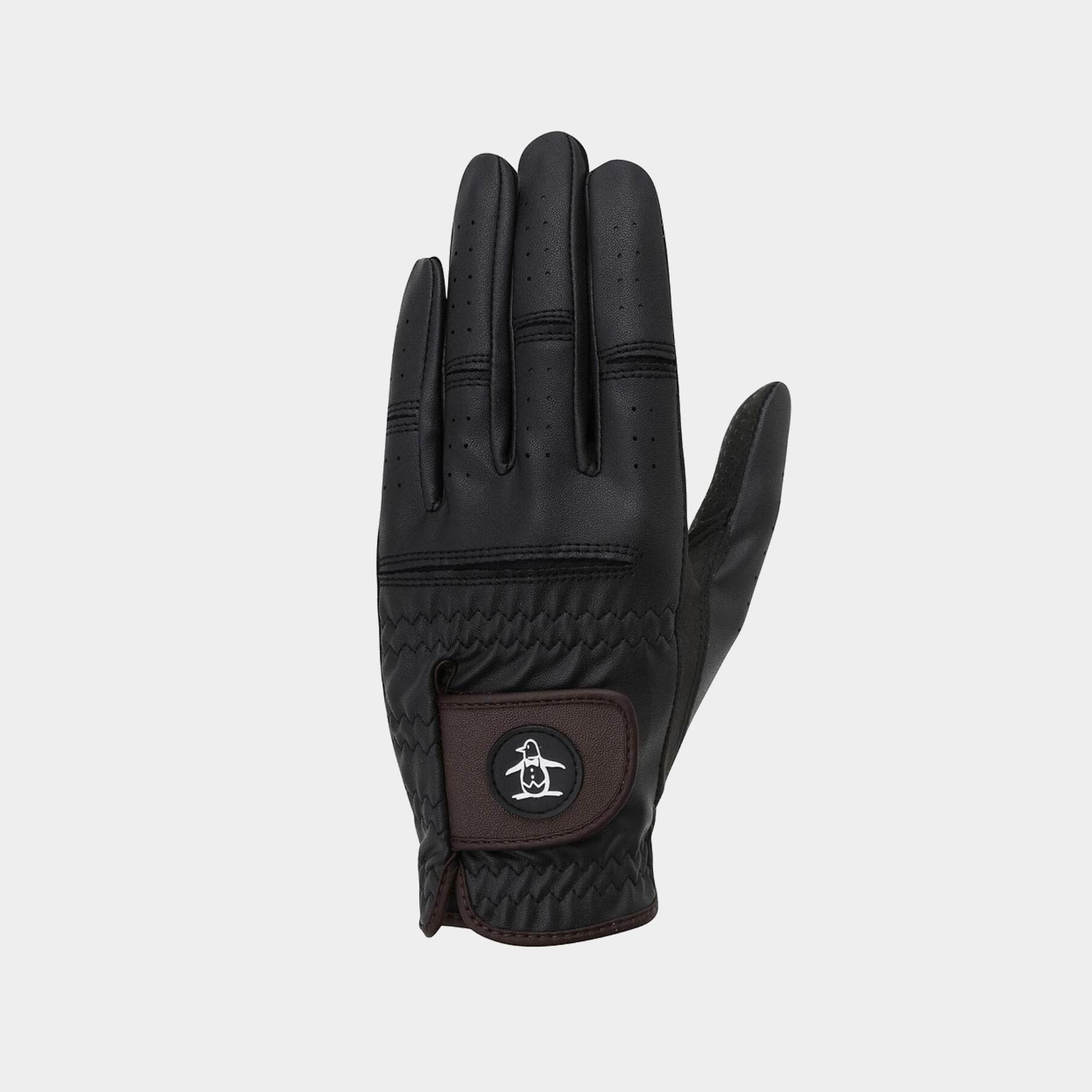 A single black leather glove shown from the back, featuring a brown leather patch on the back with a circular logo, set against a plain light gray background.