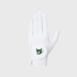 A white golf glove with a green devil logo patch on the wrist strap, shown against a light gray background.