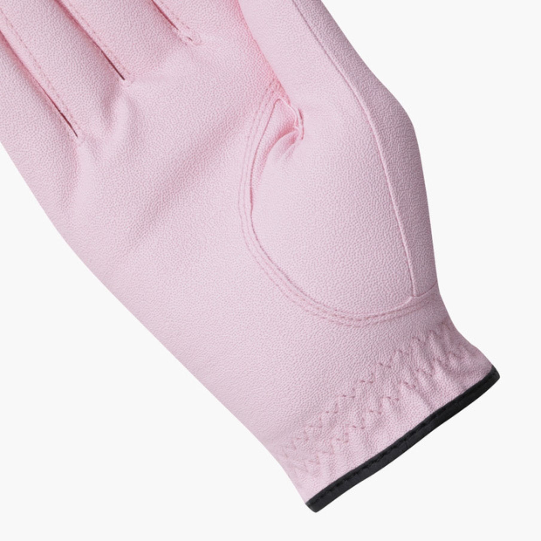 A close-up of a light pink golf glove showing the back of the hand with a black trim at the cuff, set against a plain white background.