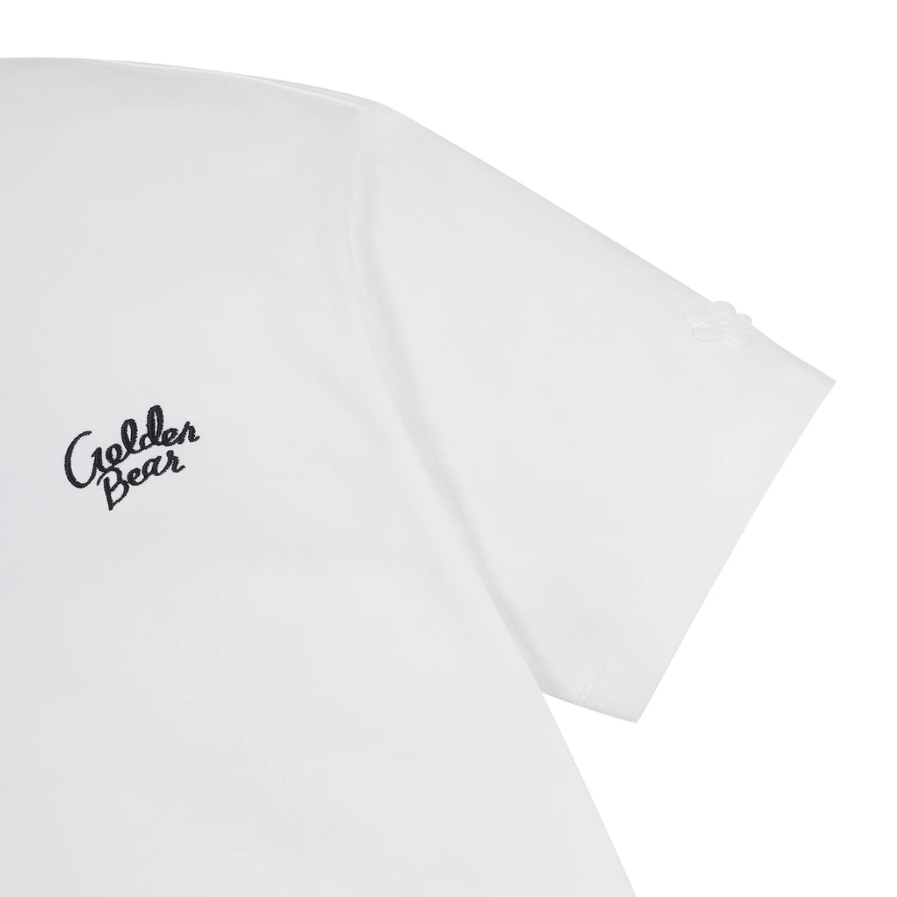 Close-up of a white short-sleeve T-shirt showing the left chest area with a black cursive 'Golden Bear' logo and part of the sleeve against a white background.
