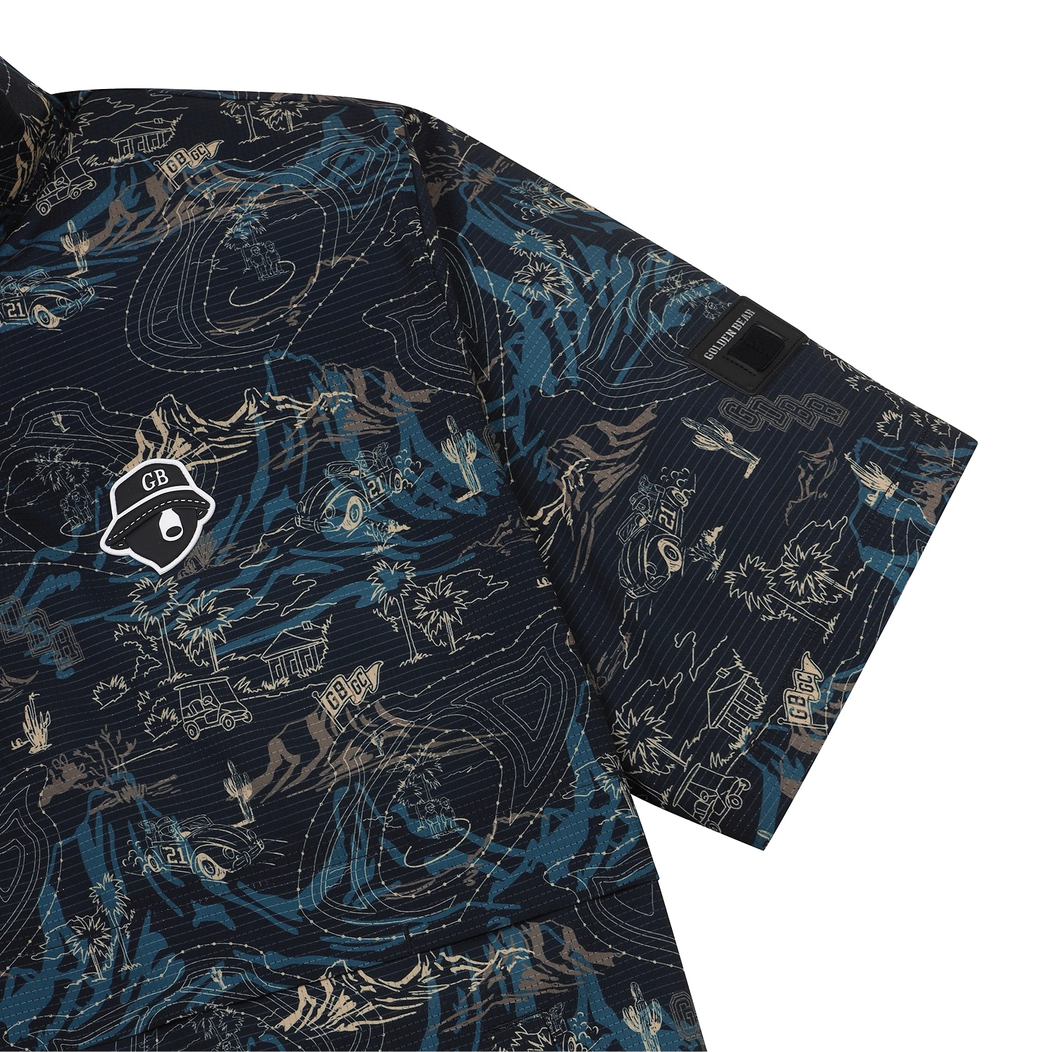 Close-up of a short-sleeve button-up shirt with a dark navy base and an all-over abstract topographic-style print in blue, beige, and white. A small white chest patch with a black outline logo is visible on the left side, and a black sleeve label reads 'SILKSTITCH'.