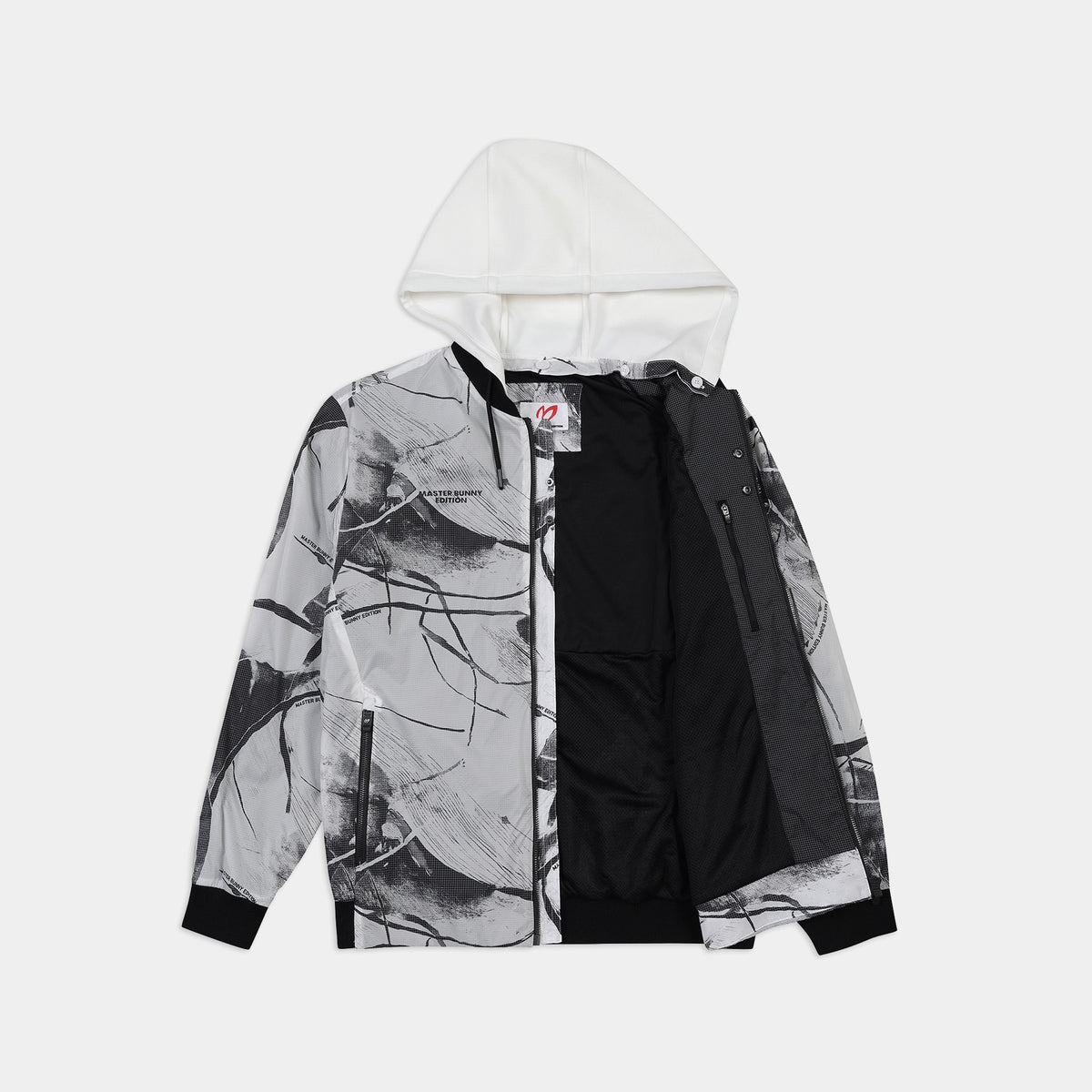 A hooded jacket with a black and white abstract brushstroke print on the outer shell, a solid black inner shell, and a white hood, shown against a light gray background.