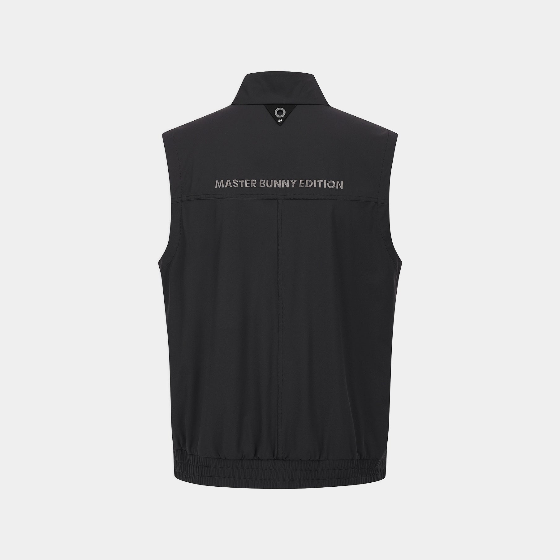 A black sleeveless zip-up vest shown from the back, featuring the text 'MASTER BUNNY EDITION' printed in white across the upper back, set against a light gray background.