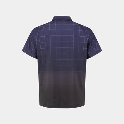 A short-sleeve polo shirt shown from the back, featuring a dark purple and black windowpane grid pattern with a smooth dark gradient at the bottom, displayed on a light gray background.