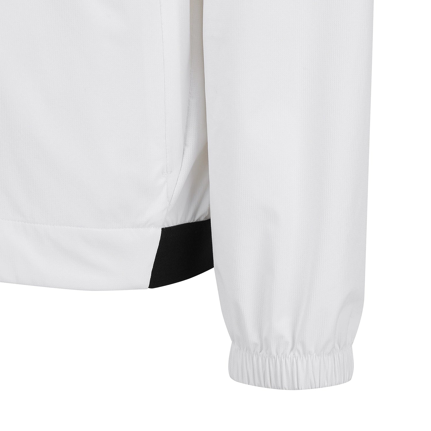 Close-up detail of a white jacket sleeve with an elastic cuff and a black contrast panel near the hem, shown on a plain white background.