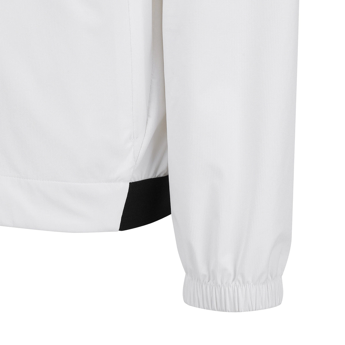 Close-up detail of a white jacket sleeve with an elastic cuff and a black contrast panel near the hem, shown on a plain white background.