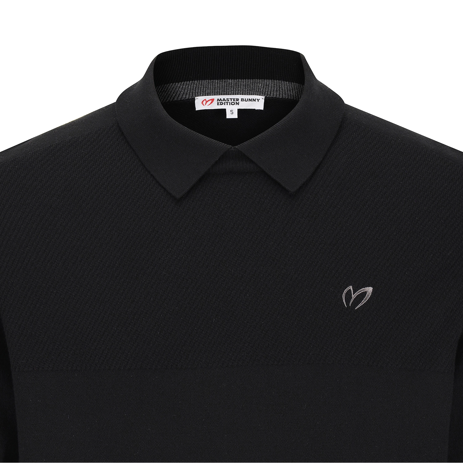 Close-up of a black long-sleeve polo shirt with a collar and a small embroidered logo on the left chest, shown against a white background.