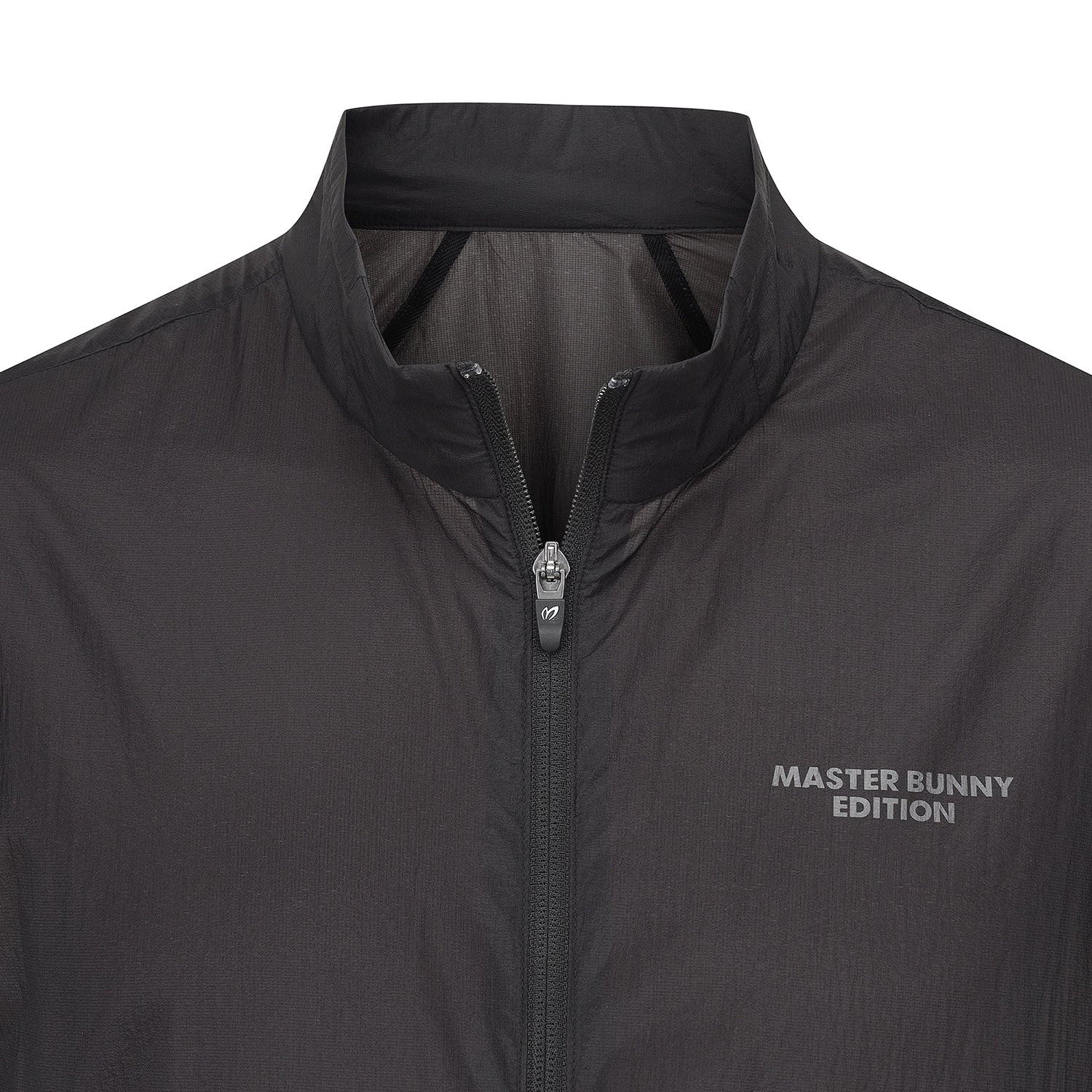 Close-up of a dark gray lightweight jacket with a stand-up collar, front zipper, and 'MASTER BUNNY EDITION' text on the chest.