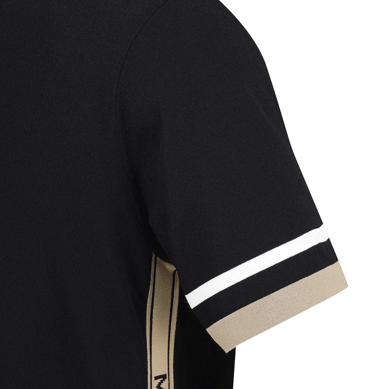 Close-up of a black short-sleeve athletic top showing the sleeve cuff with two horizontal stripes: one white and one beige, plus a beige vertical stripe detail on the lower sleeve.