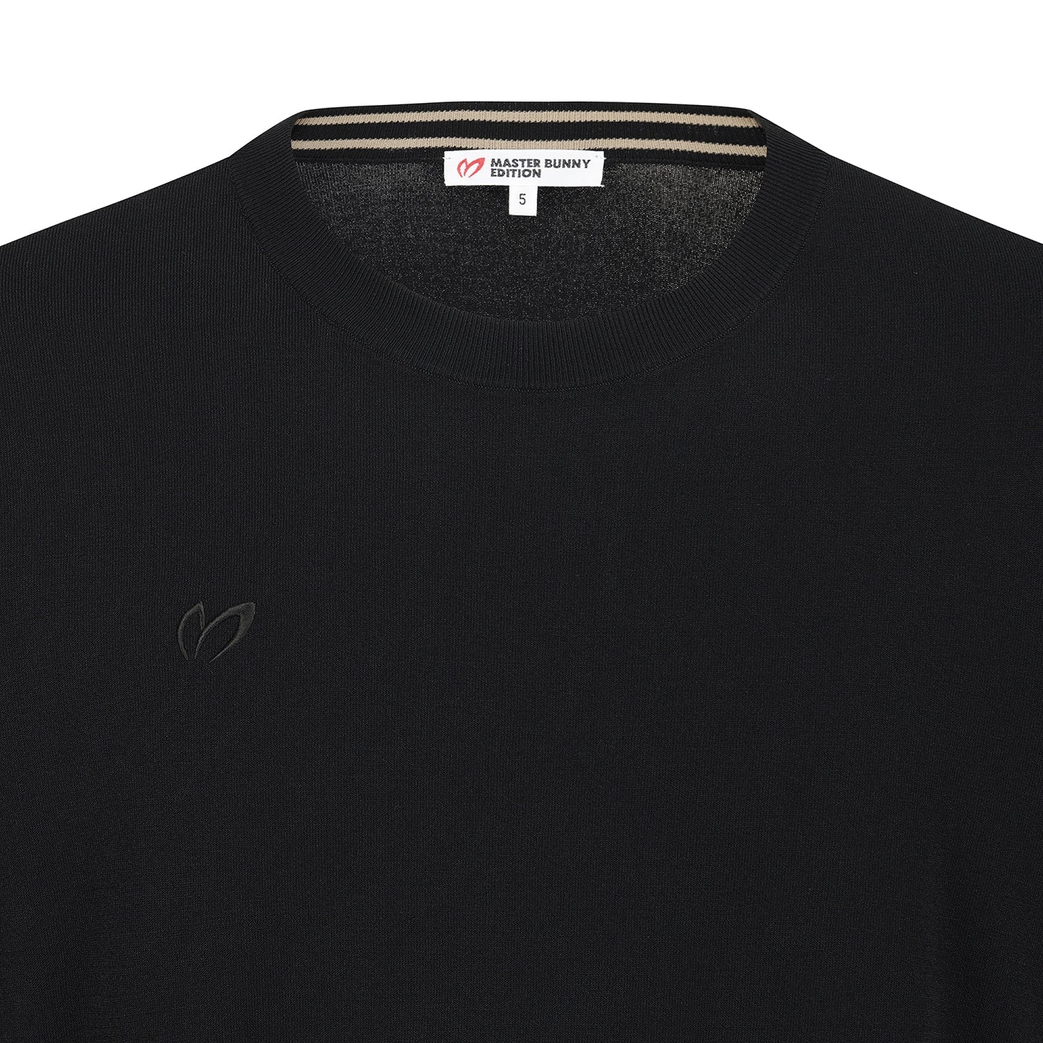 Close-up of a black knit crewneck sweater by Master Bunny Edition, showing the inner neck label and a subtle tonal embroidered logo on the left chest.