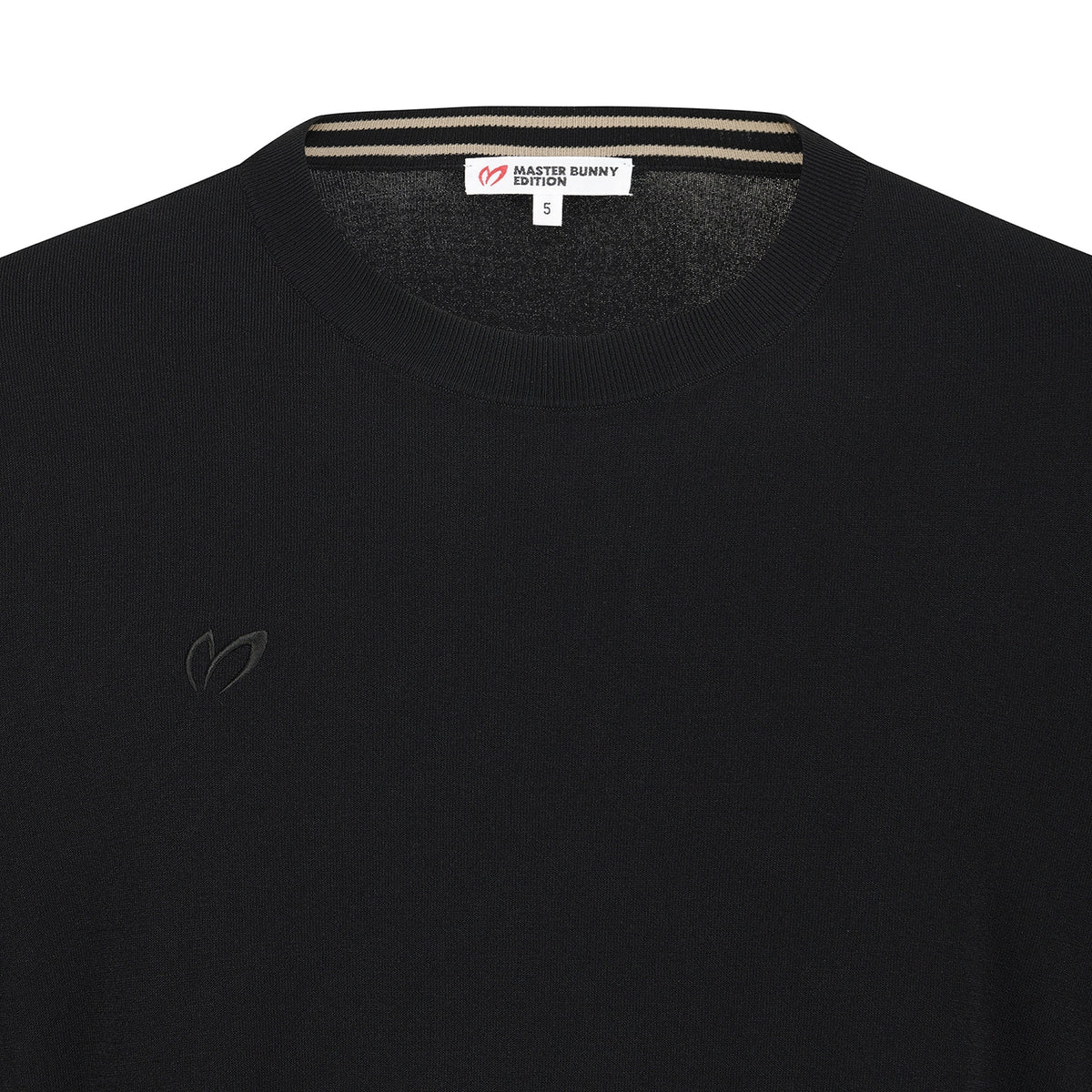 Close-up of a black knit crewneck sweater by Master Bunny Edition, showing the inner neck label and a subtle tonal embroidered logo on the left chest.