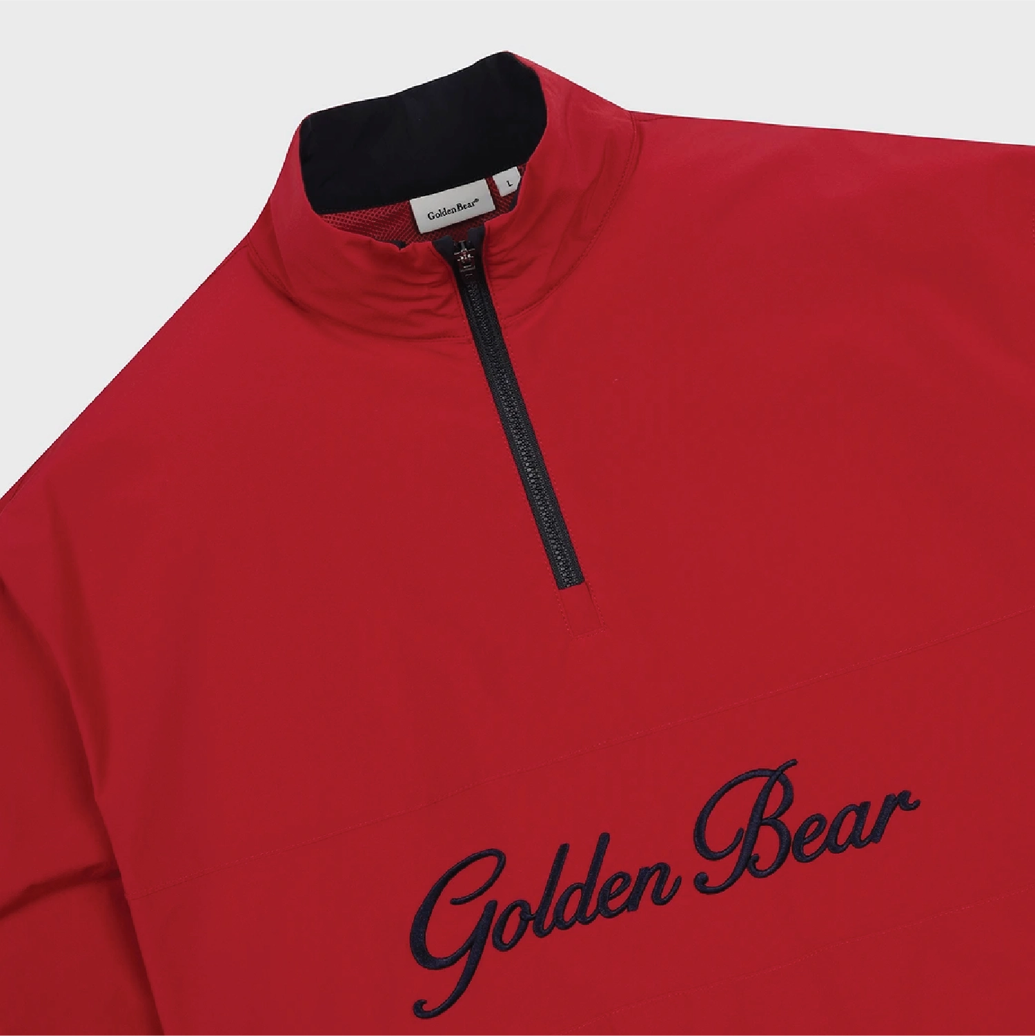 A close-up of a red quarter-zip pullover sweatshirt with a black collar and black 'Golden Bear' script embroidery on the chest, shown against a light gray background.