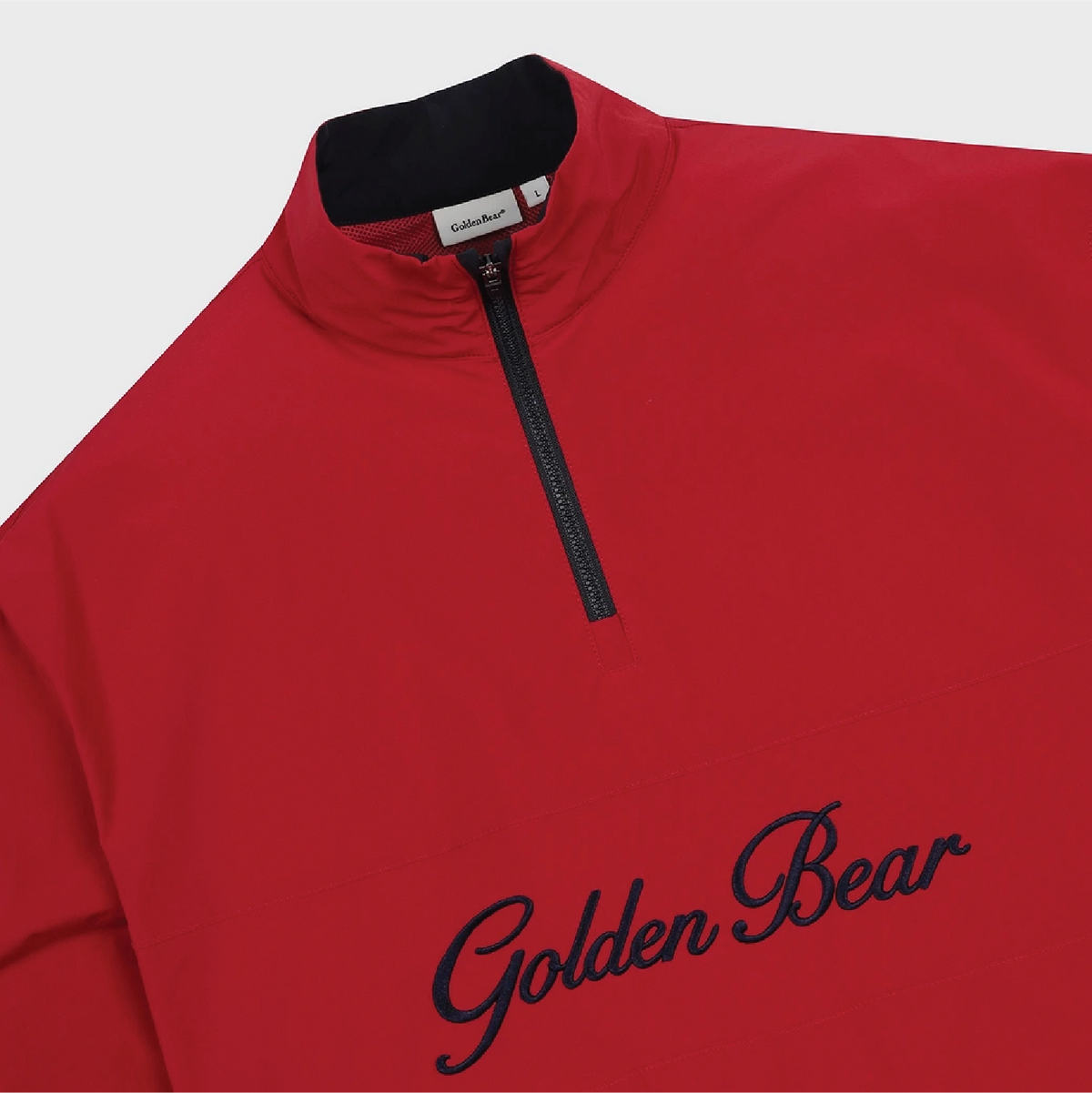 A close-up of a red quarter-zip pullover sweatshirt with a black collar and black 'Golden Bear' script embroidery on the chest, shown against a light gray background.