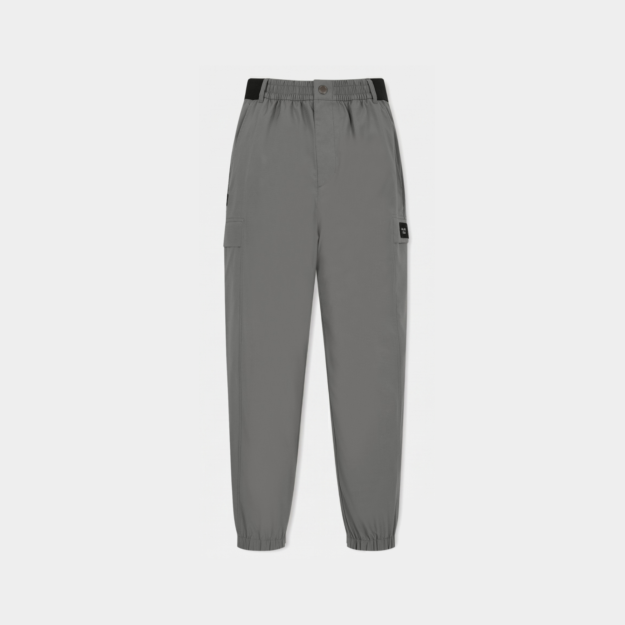 A pair of gray jogger-style pants with an elastic waistband, side cargo pocket, and elastic cuffs, shown flat against a light gray background.