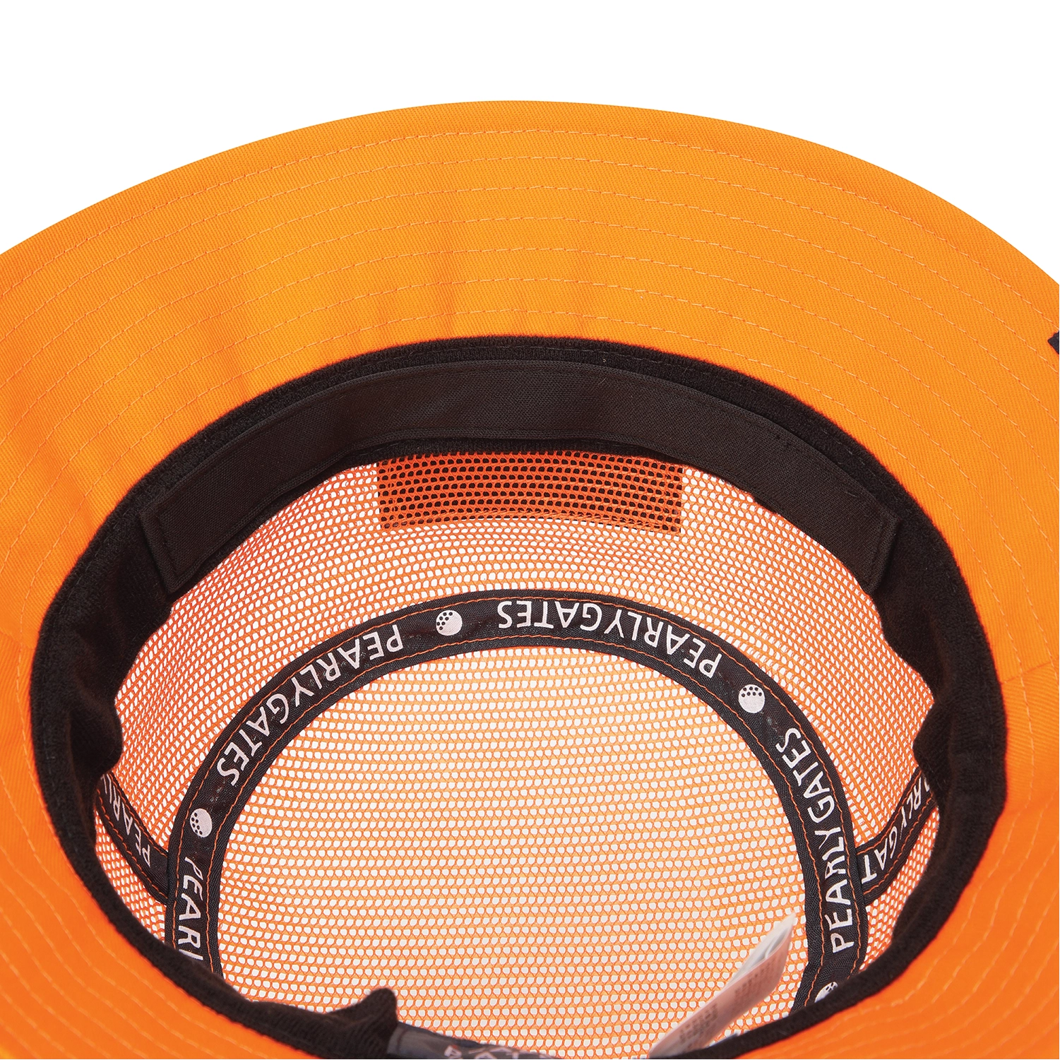Close-up of the inside of a bright orange hard hat, showing the orange mesh lining, black inner band, and white printed brand name 'PEARLY GATES' repeated around the band.