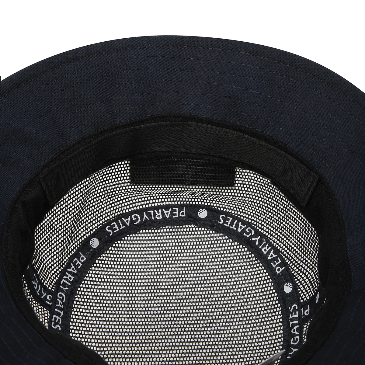 Close-up of the inside of a dark navy or black bucket hat, showing the mesh lining and a black elastic band printed with the brand name 'PEARLY GATES'.