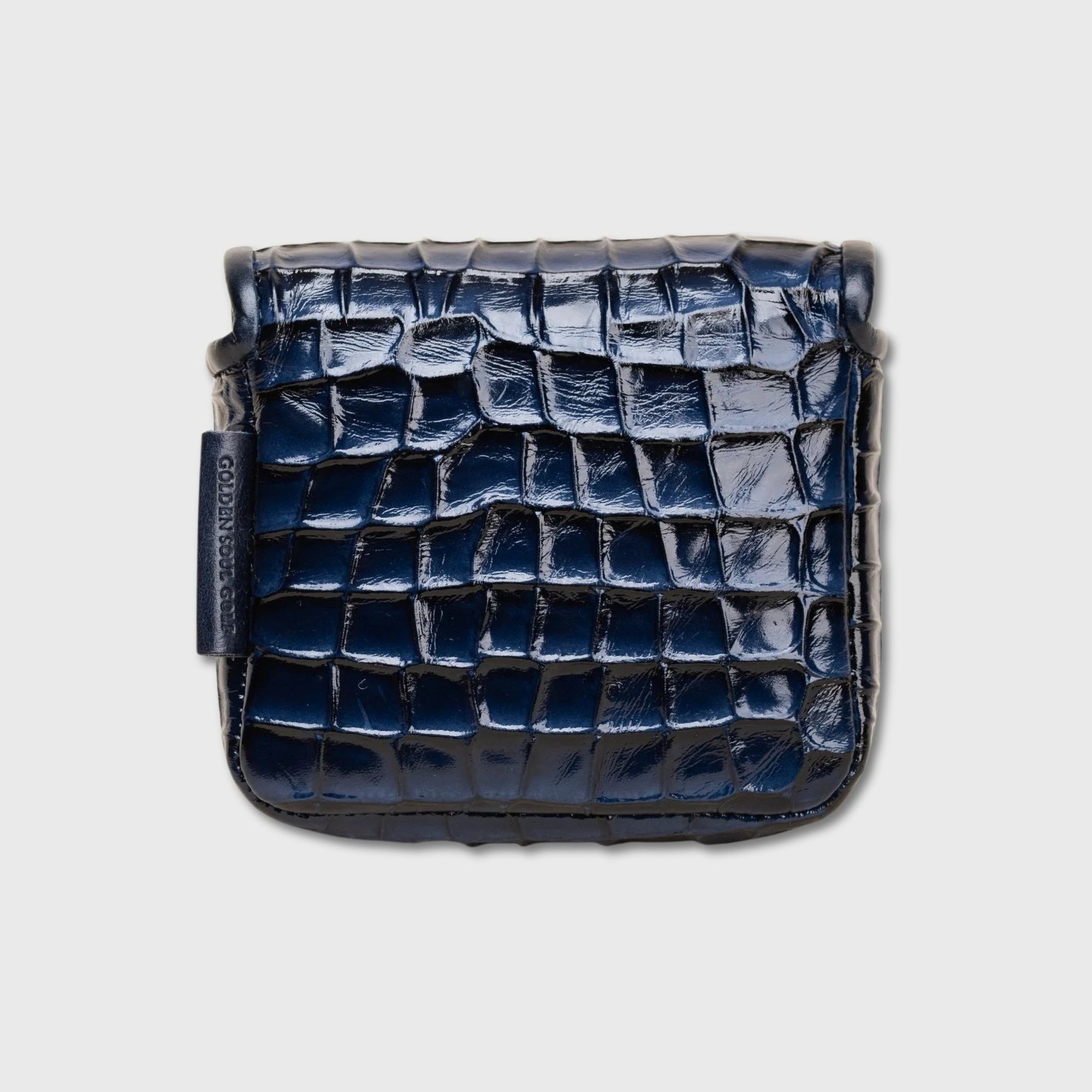 A dark navy blue crocodile-embossed leather ZT Spider putter cover with a glossy finish, shown from a top-down view on a light gray background.