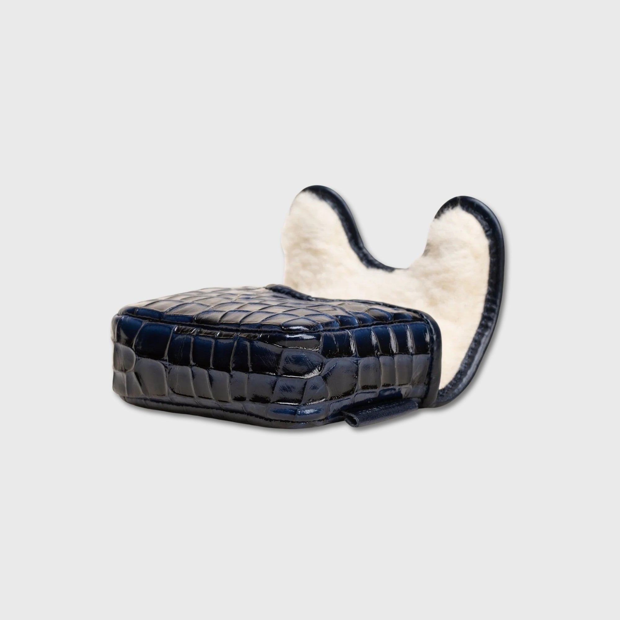 A small structured ZT Spider putter cover with a glossy dark navy crocodile-embossed exterior and a plush cream interior lining, shown on a plain light gray background.