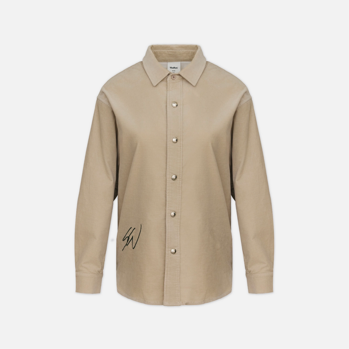 A beige long-sleeve button-up shirt with a pointed collar, silver-tone buttons, and a black script signature on the lower left front, displayed on a clean light gray background.