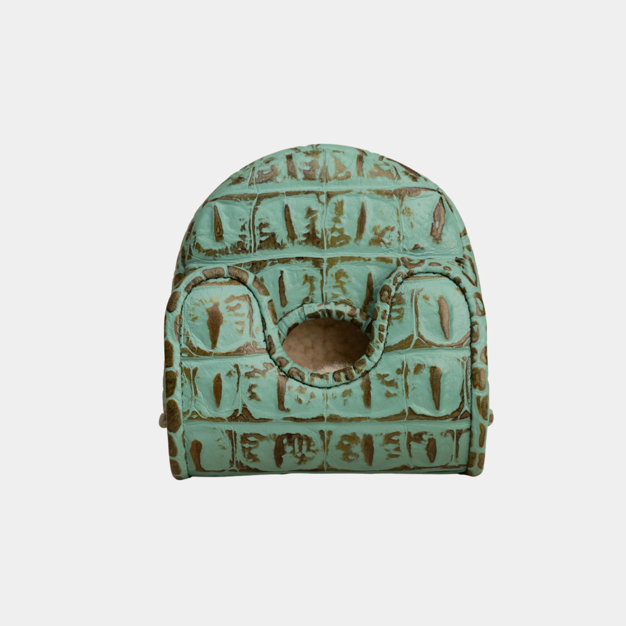 A small vintage-style green crocodile-patterned center df3 putter cover with a circular cutout, shown against a plain light gray background.
