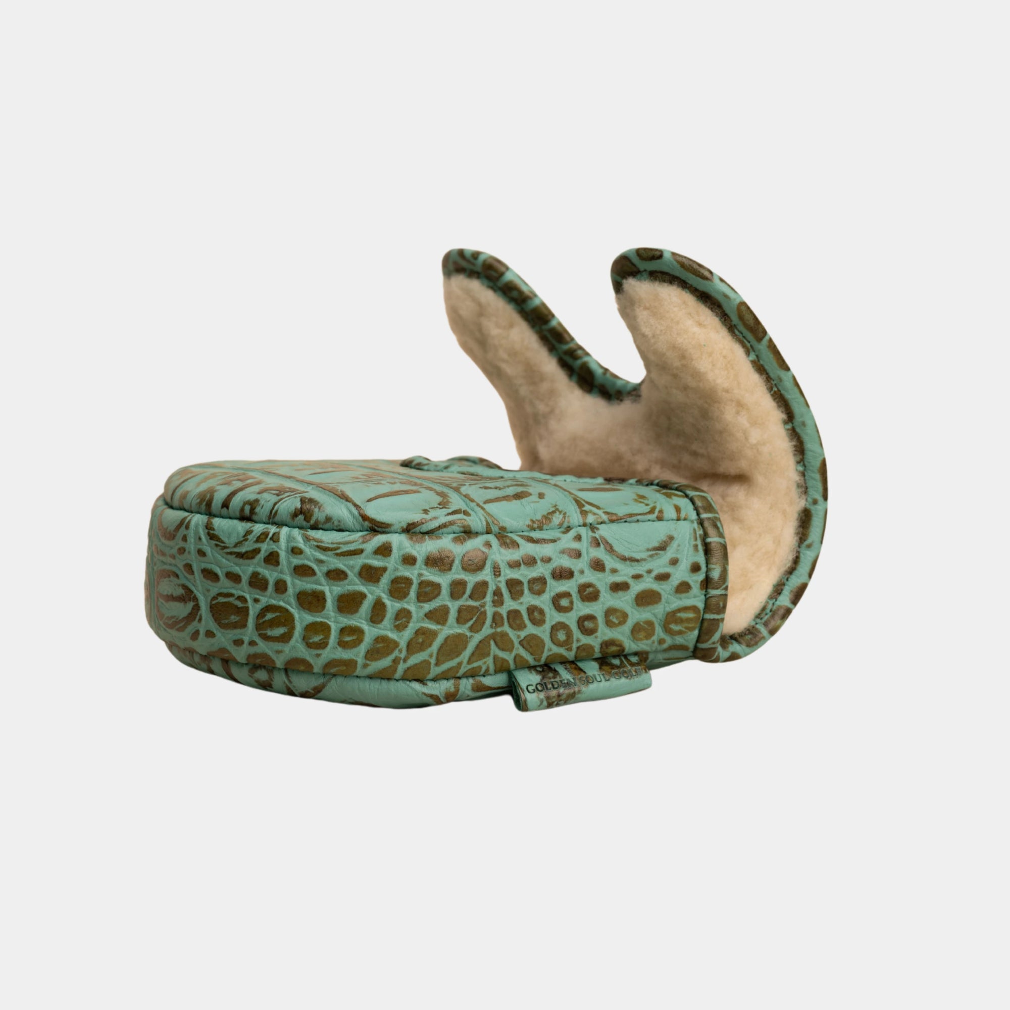 A  center df3 putter cover with a turquoise and brown crocodile-embossed exterior and a beige sherpa lining, shown open on a light gray background.