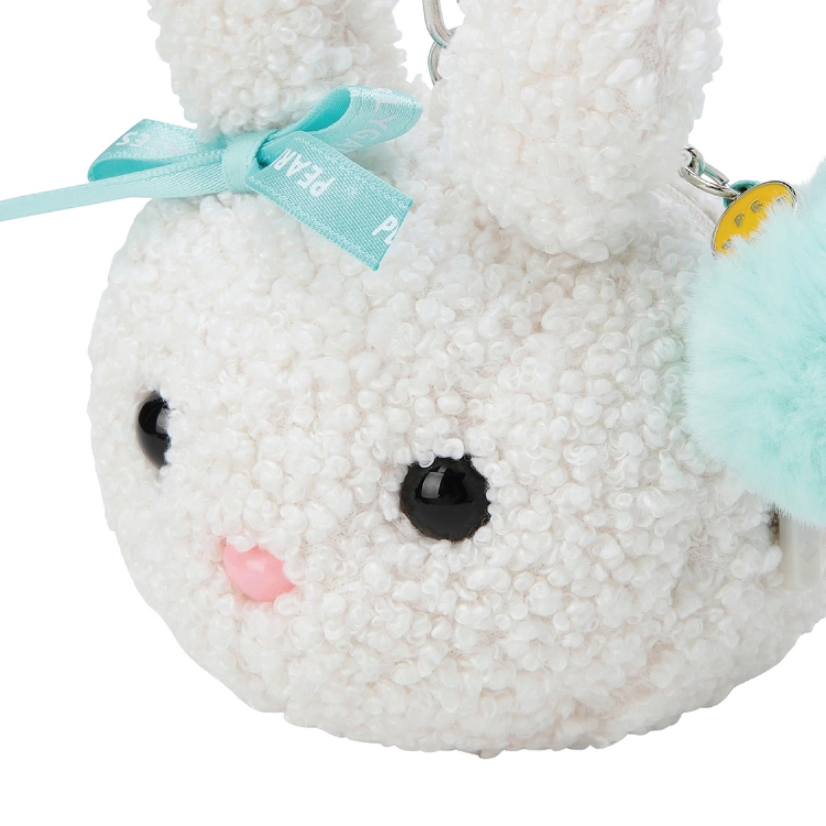A white textured plush bunny keychain or coin purse with black bead eyes, a pink stitched nose, a light blue ribbon bow, and a mint green pom-pom accessory on a white background.