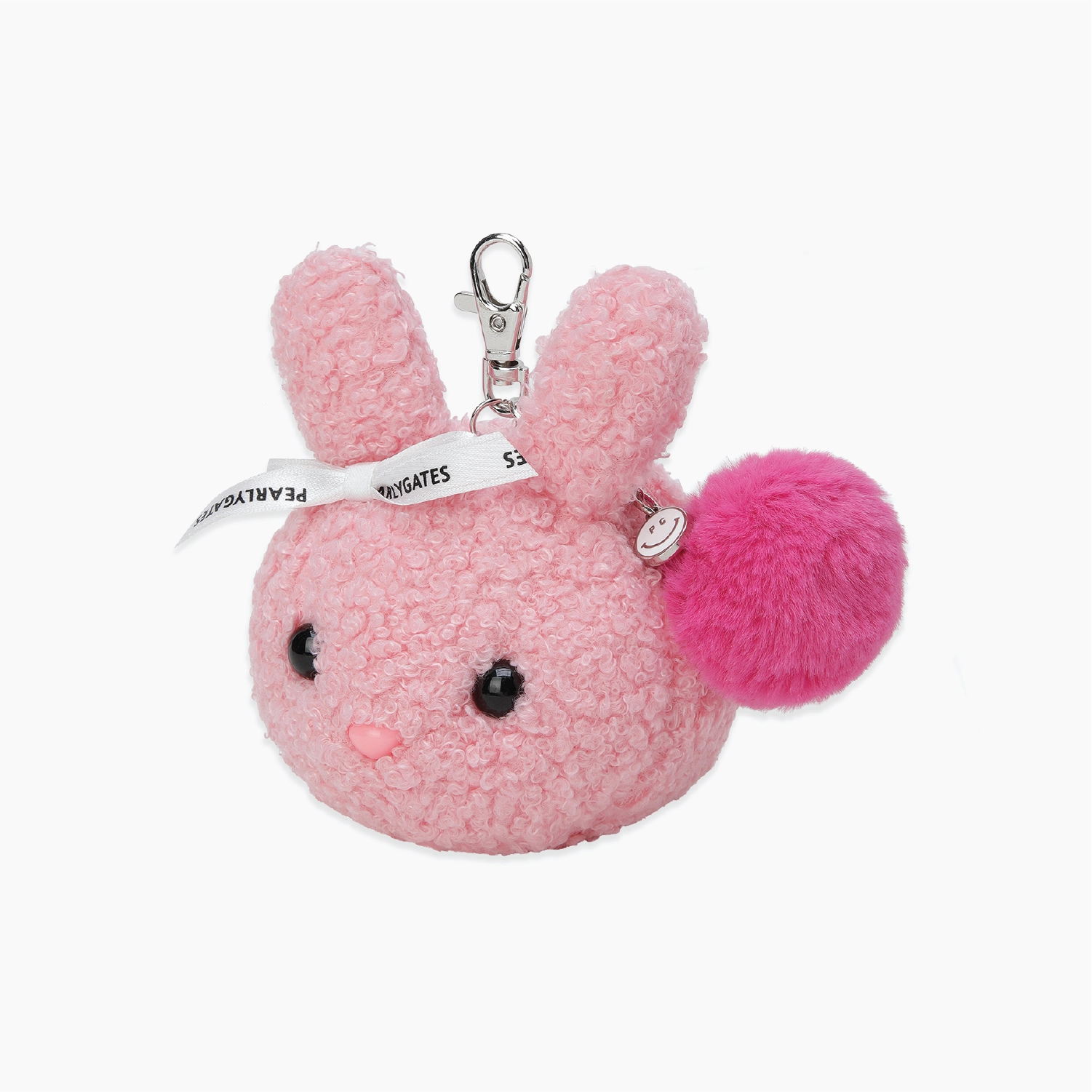 A pink fuzzy plush bunny keychain with long ears, black bead eyes, a small pink nose, a silver clasp, a white printed ribbon, and a bright pink pom-pom accent, shown on a plain white background.