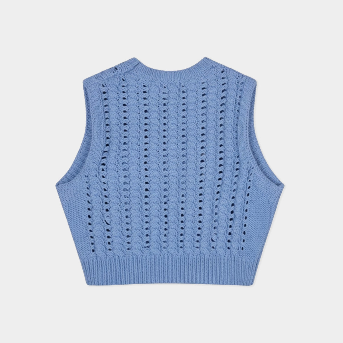 A light blue knit sleeveless vest with a textured openwork pattern, shown from the back on a light gray background.