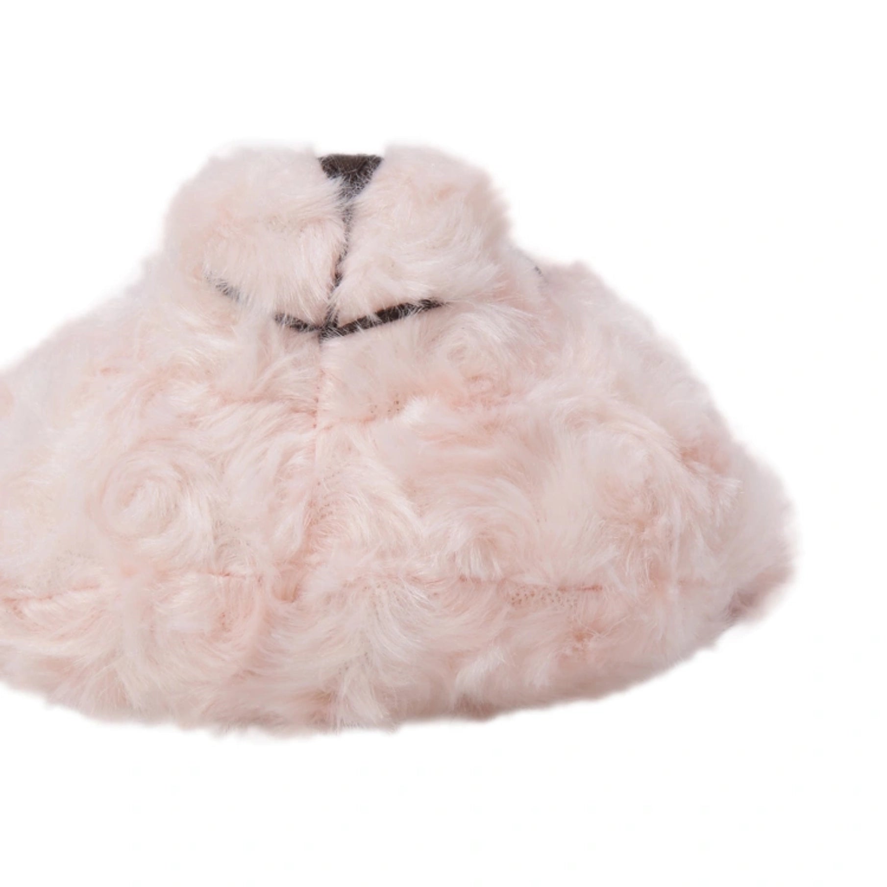A light pink fluffy faux fur hat with a small black embroidered detail on the front, shown against a plain white background.