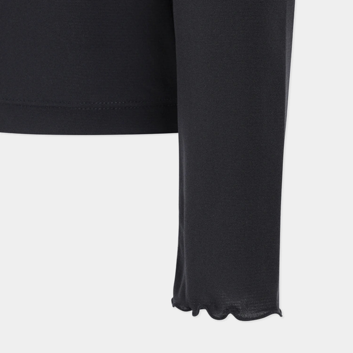 Close-up of a black long-sleeve garment with a scalloped hem and fine knit texture, shown against a light gray background.