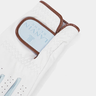 A close-up of a white golf glove with brown trim and a light blue brand patch reading LANYN BLANC, shown on a clean white background.
