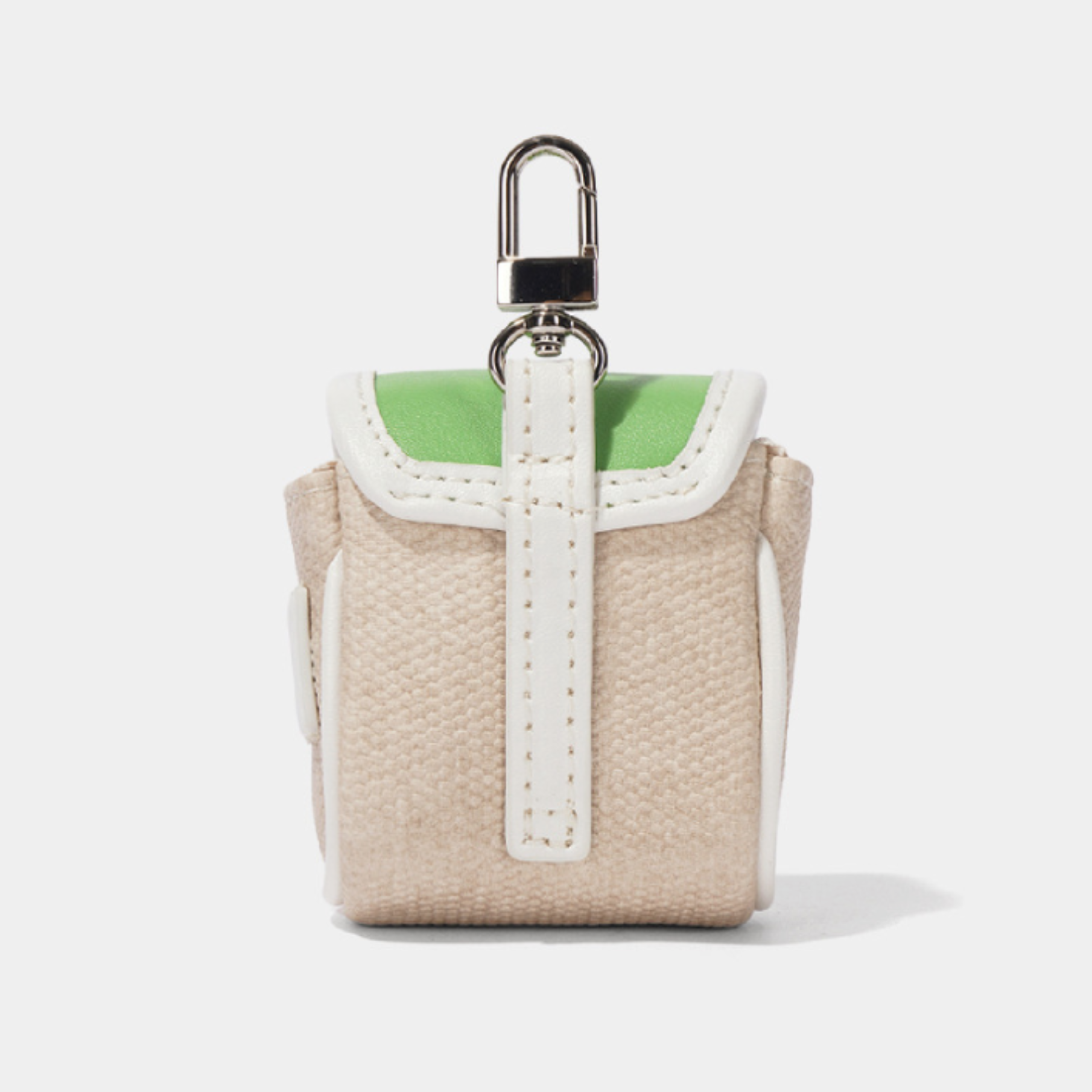 A small woven canvas pouch in beige with white trim and a bright green interior lining, attached to a silver metal carabiner clip, shown on a light gray background.