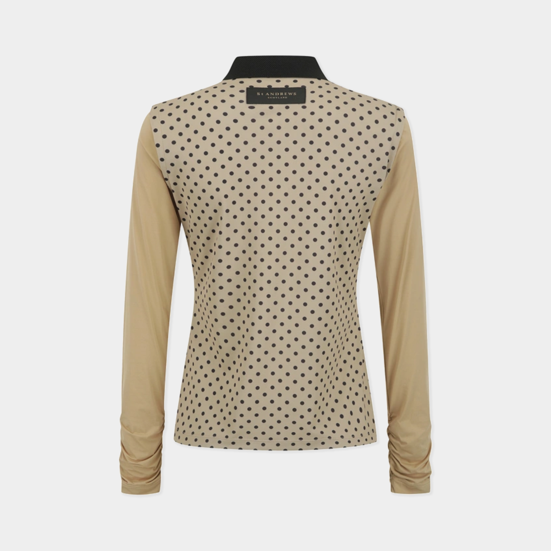 A women's long-sleeve top shown from the back, featuring a beige base with a black polka dot pattern across the upper back and shoulders, and solid beige sleeves and collar. The brand name 'ALEXANDER WANG' is visible on the inner neck label.