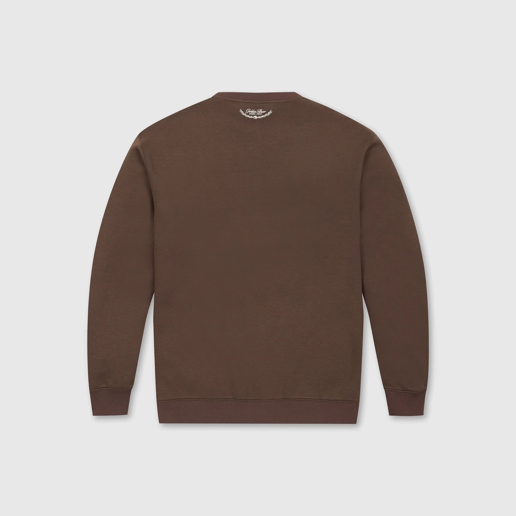 A brown crewneck sweatshirt shown from the back, featuring a small white embroidered logo at the inner neckline, displayed on a light gray background.
