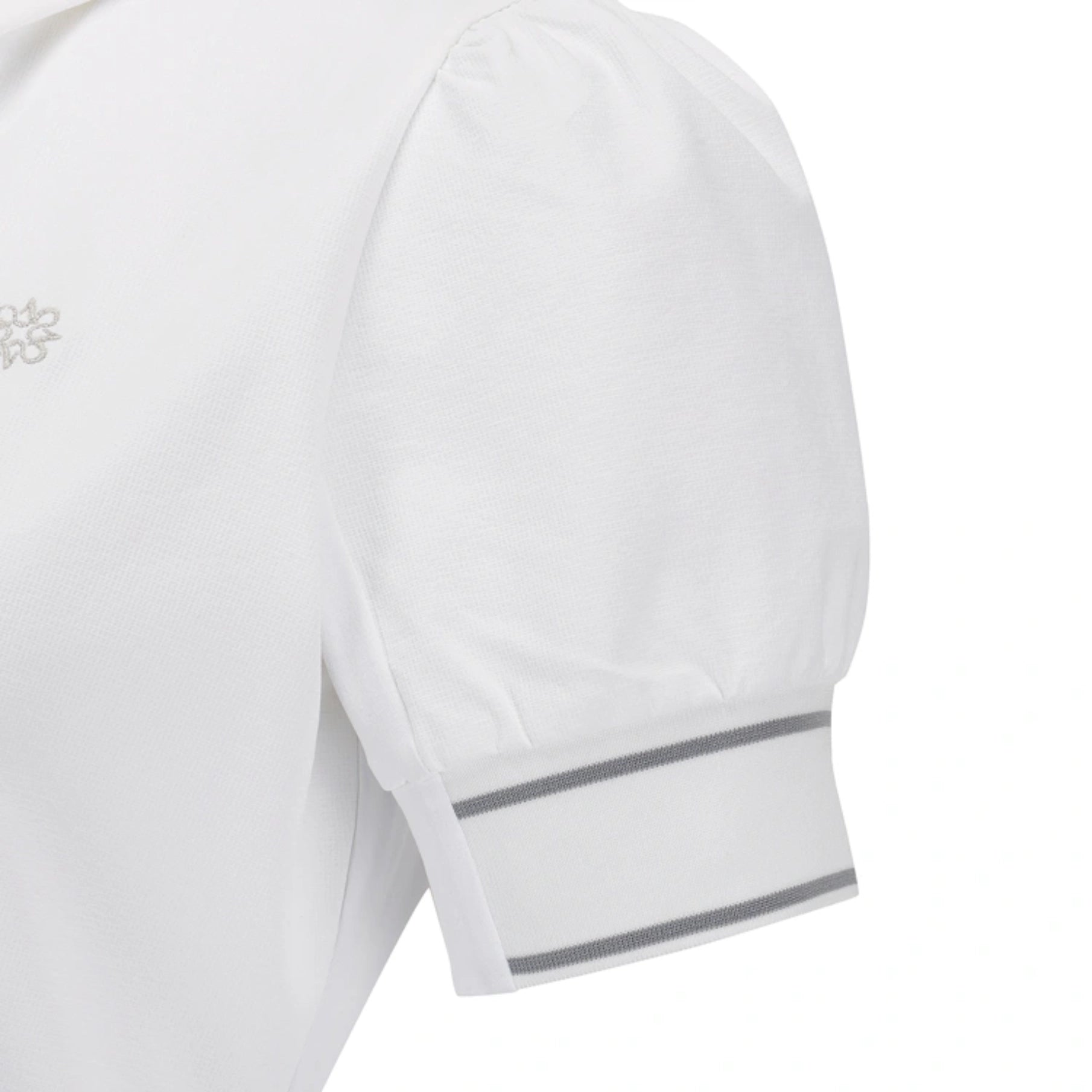 Close-up of a white short-sleeve top showing the shoulder, sleeve, and cuff with two thin gray stripes near the hem.