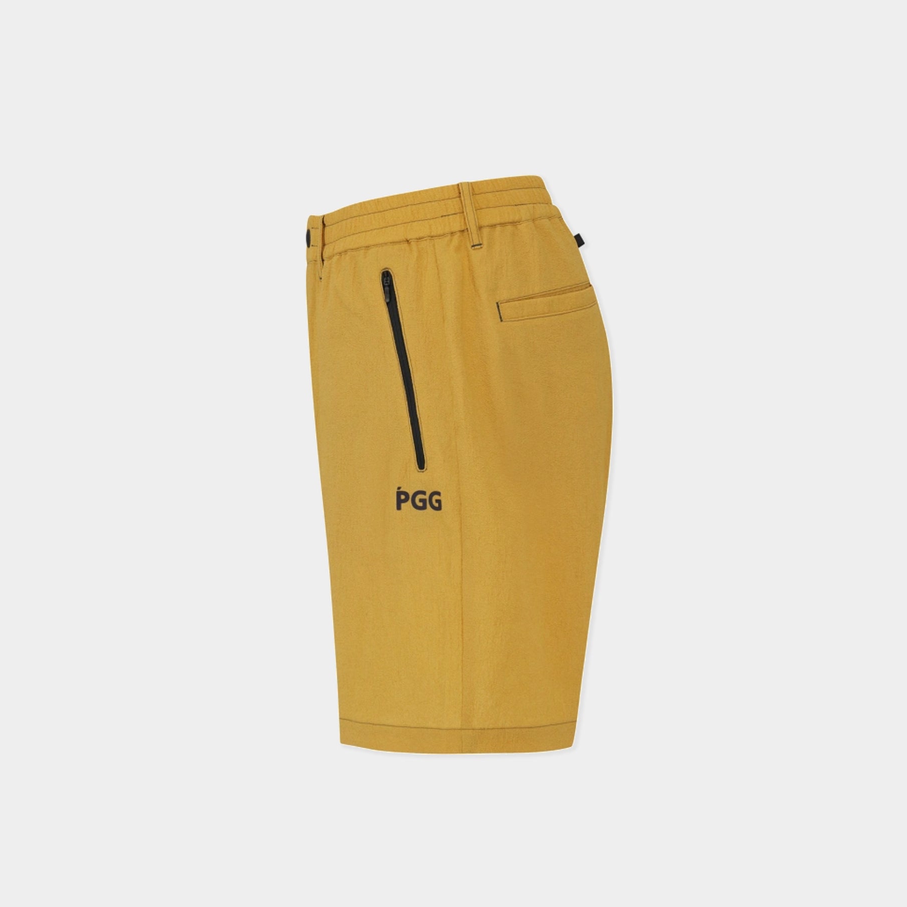 A pair of yellow PGG golf shorts with a black vertical zipper pocket and black PGG logo on the side, shown against a light gray background.