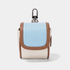 A small camera pouch with a light blue front flap, tan leather trim, and a textured off-white body, featuring a silver metal carabiner clip on top.