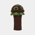 A crocheted golf club headcover shaped like a turtle, featuring a dark brown body and cap with olive green accents and a small embroidered face on the side, shown against a light gray background.