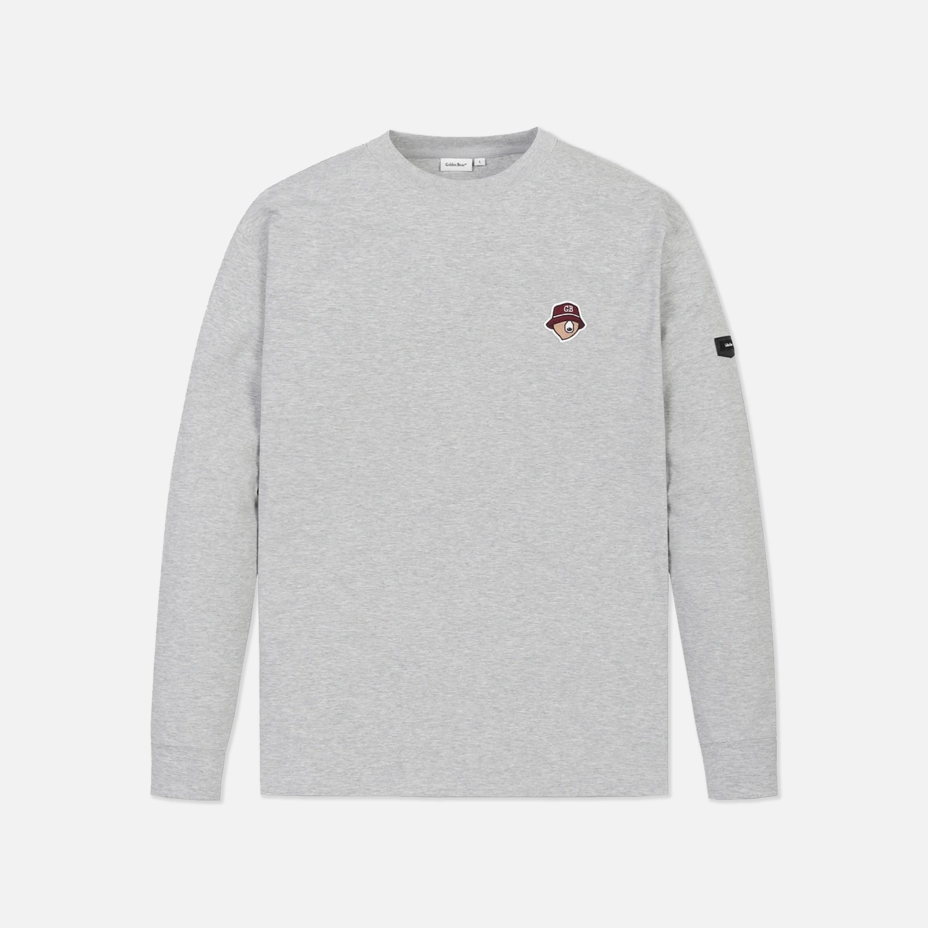 A light gray heather crewneck sweatshirt with a small embroidered patch on the left chest and a black sleeve tag, shown against a light gray background.