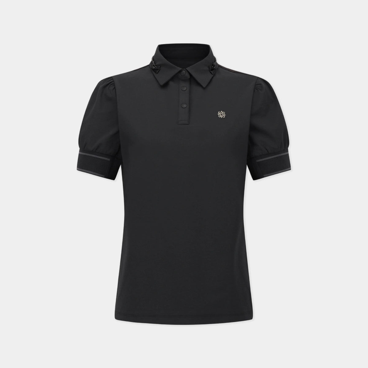 A black short-sleeve polo shirt with a small gold embroidered logo on the left chest, displayed on a clean light gray background.