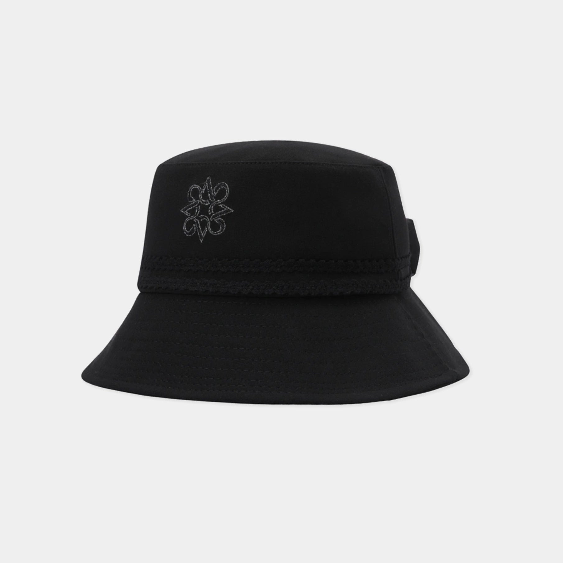 A black bucket hat with a small gray embroidered floral logo on the front, shown against a light gray background.