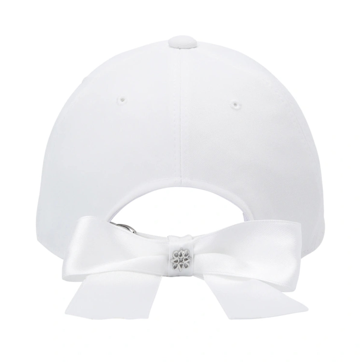 White baseball cap shown from the back, featuring a satin bow with a small rhinestone floral accent at the center.